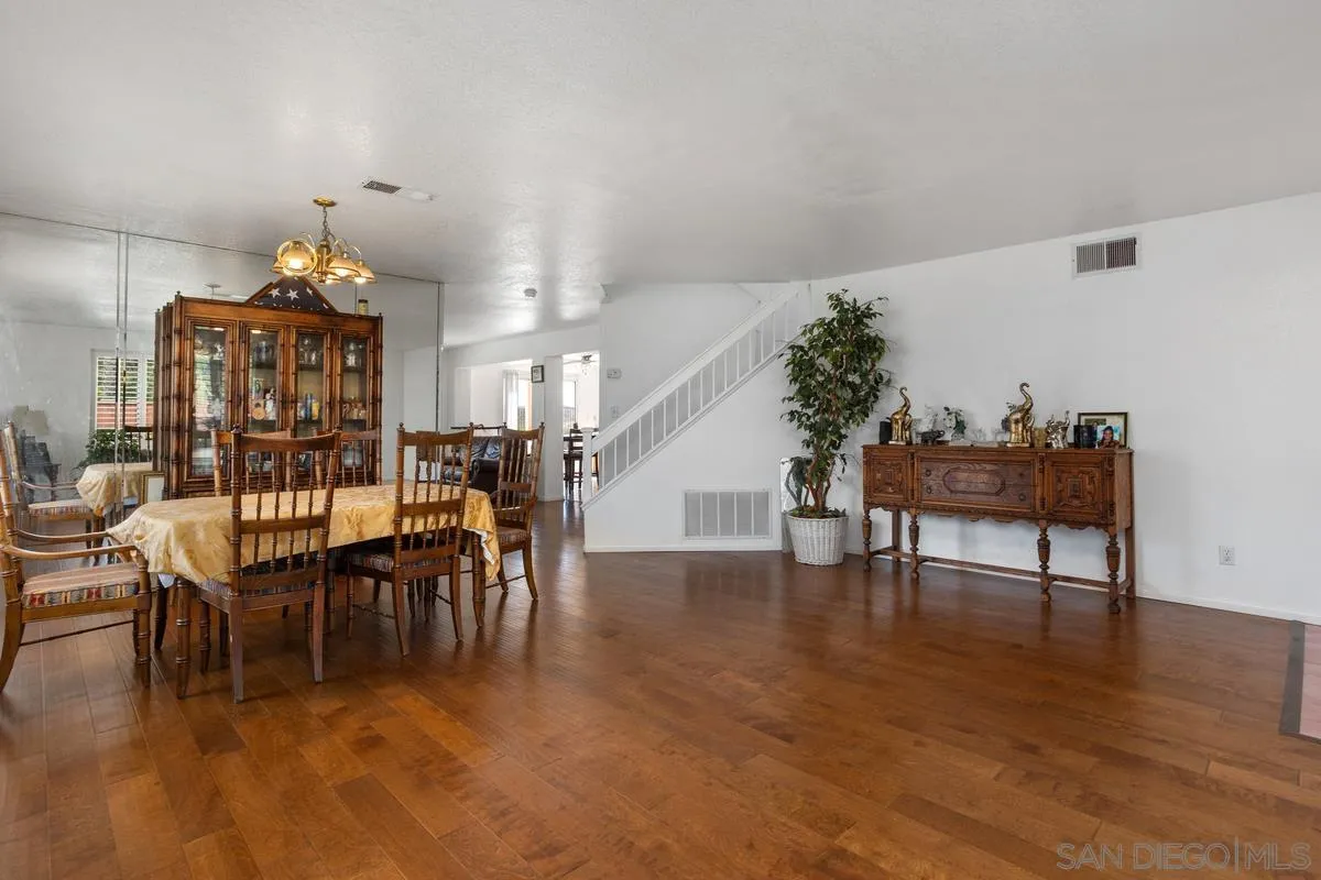 408 Shadow Tree Drive Oceanside, CA 92058 - Photo 4 of 29 a view of a dining room with furniture and wooden floor
