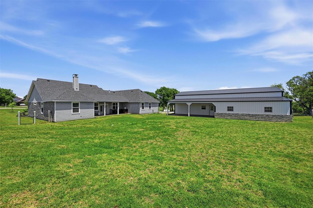 662 Preakness Place Road Van Alstyne, TX 75495 - Photo 28 of 39 a front view of a house with garden