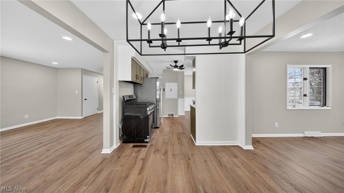 16811 Invermere Avenue Cleveland, OH 44128 - Photo 15 of 47 Unfurnished living room with recessed lighting, light wood-style floors, and a chandelier