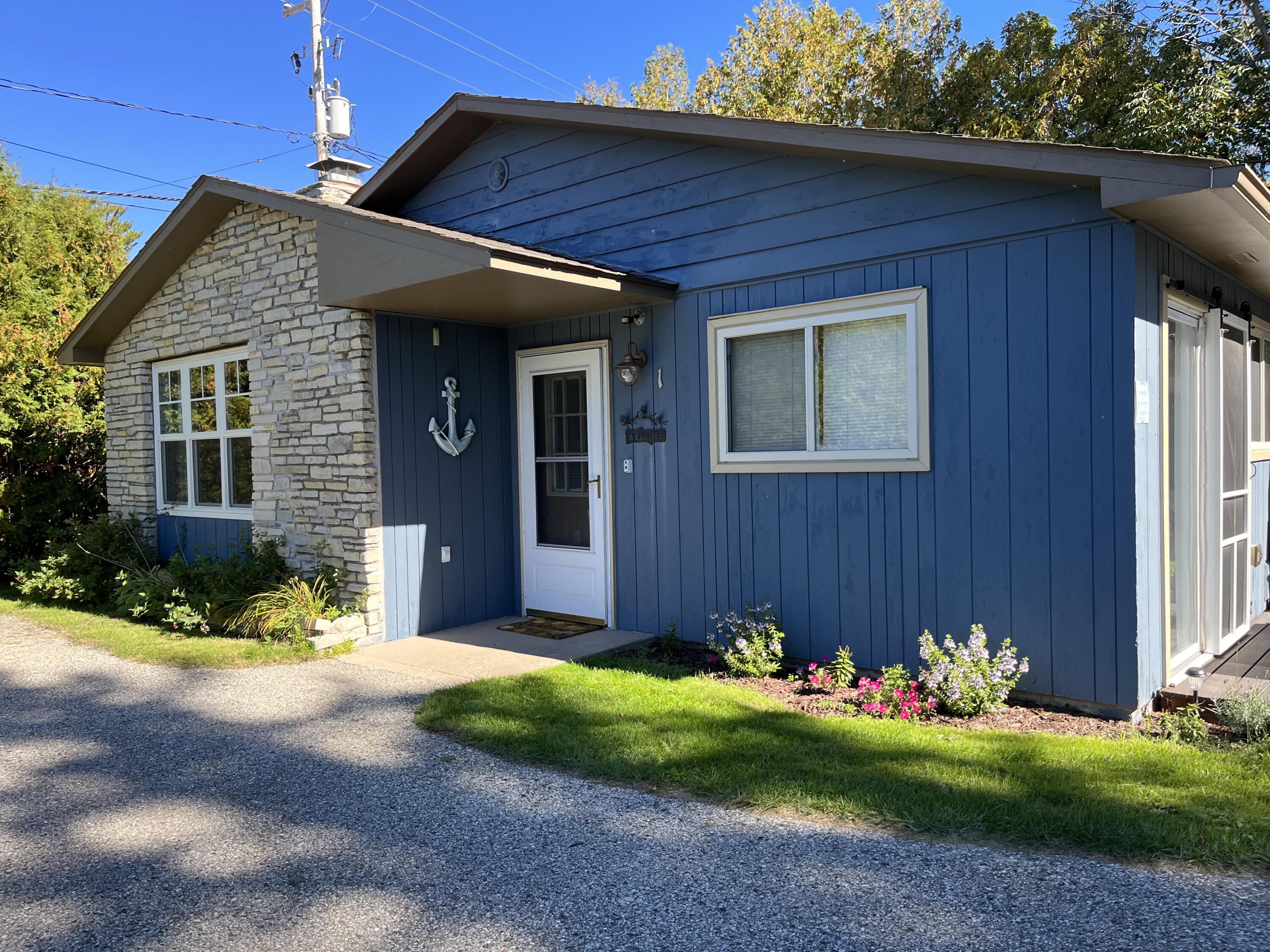 4488 Oden Road, Unit 1 Alanson, MI 49706 - Photo 1 of 20 Front