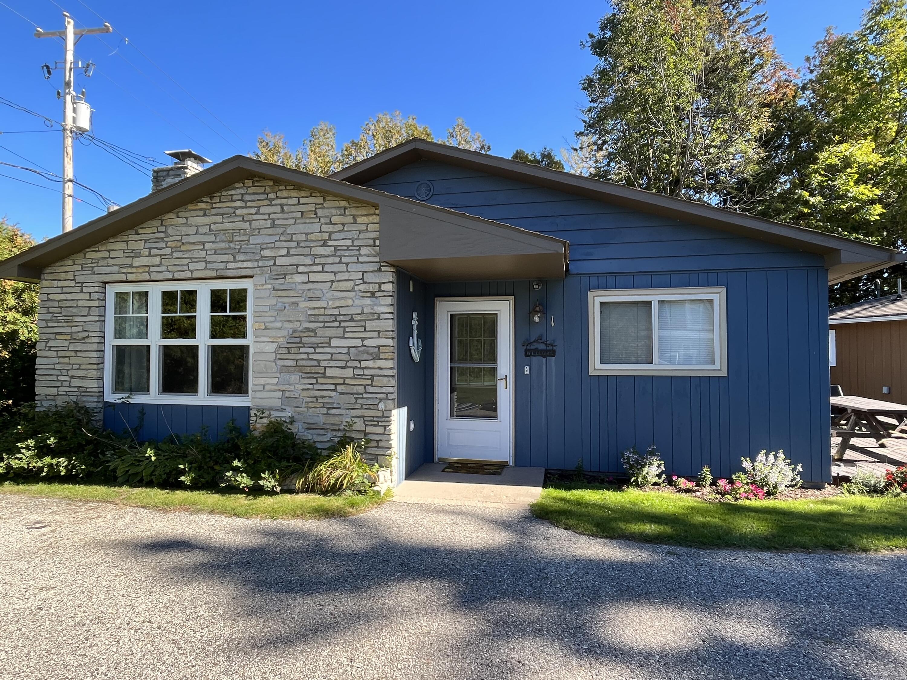 4488 Oden Road, Unit 1 Alanson, MI 49706 - Photo 3 of 20 Front