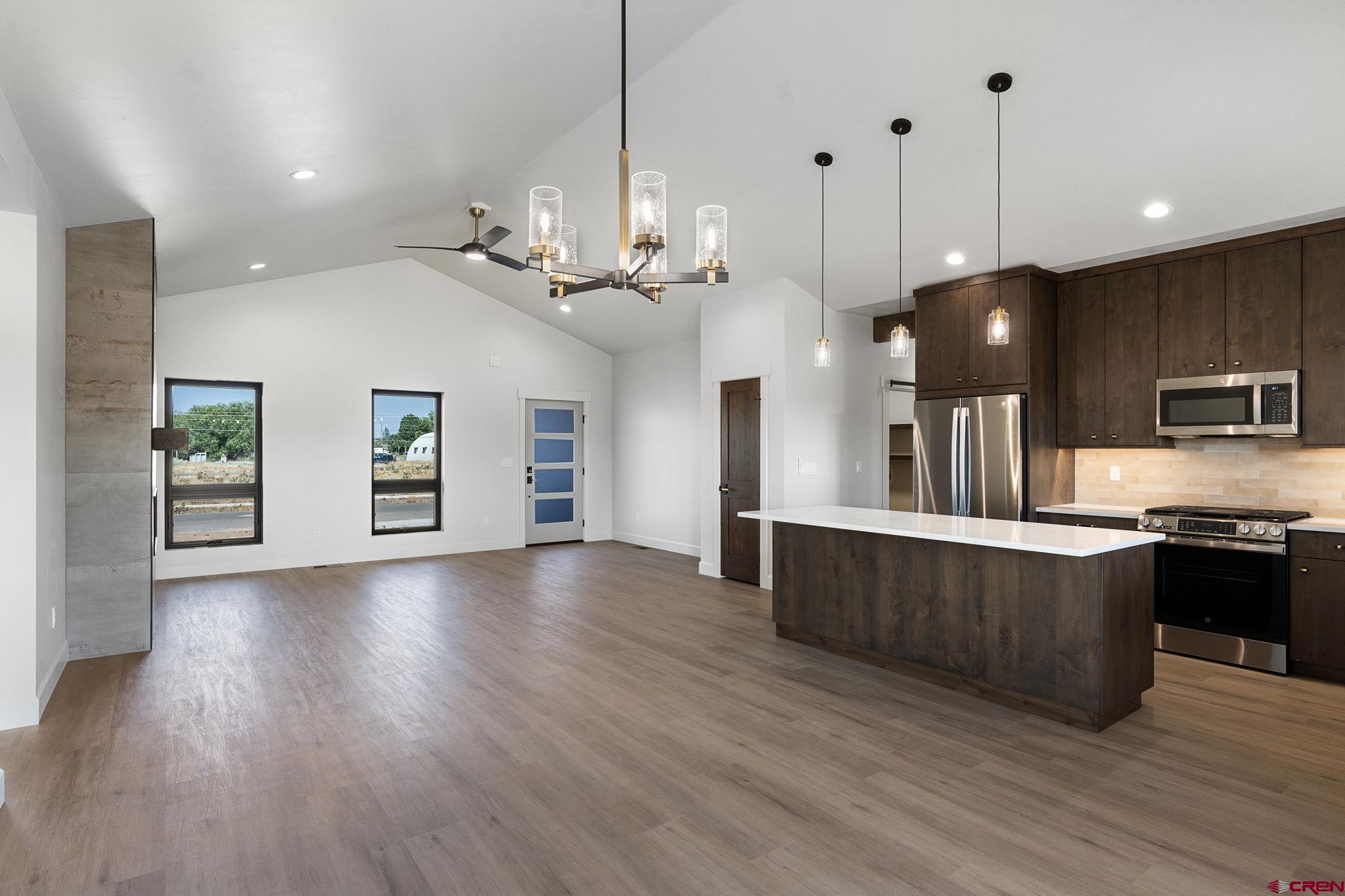 208 Petra Court Durango, CO 81303 - Photo 17 of 38 a view of a kitchen with sink and wooden floor