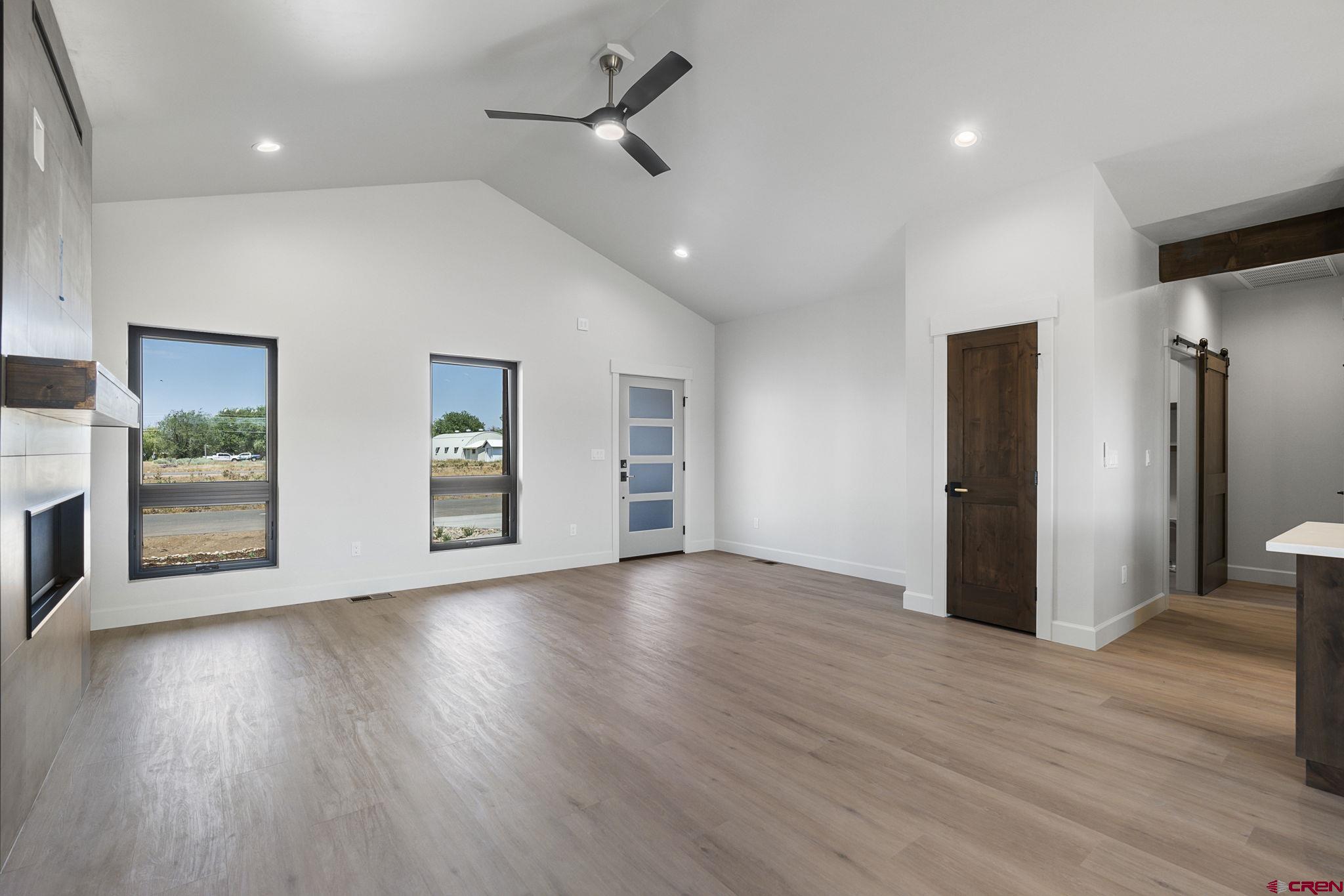 208 Petra Court Durango, CO 81303 - Photo 18 of 38 a view of an empty room with wooden floor and a window
