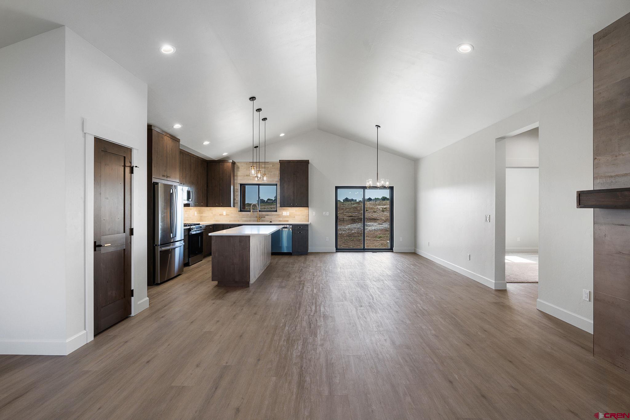 208 Petra Court Durango, CO 81303 - Photo 19 of 38 a kitchen with stainless steel appliances a refrigerator sink a stove and cabinets