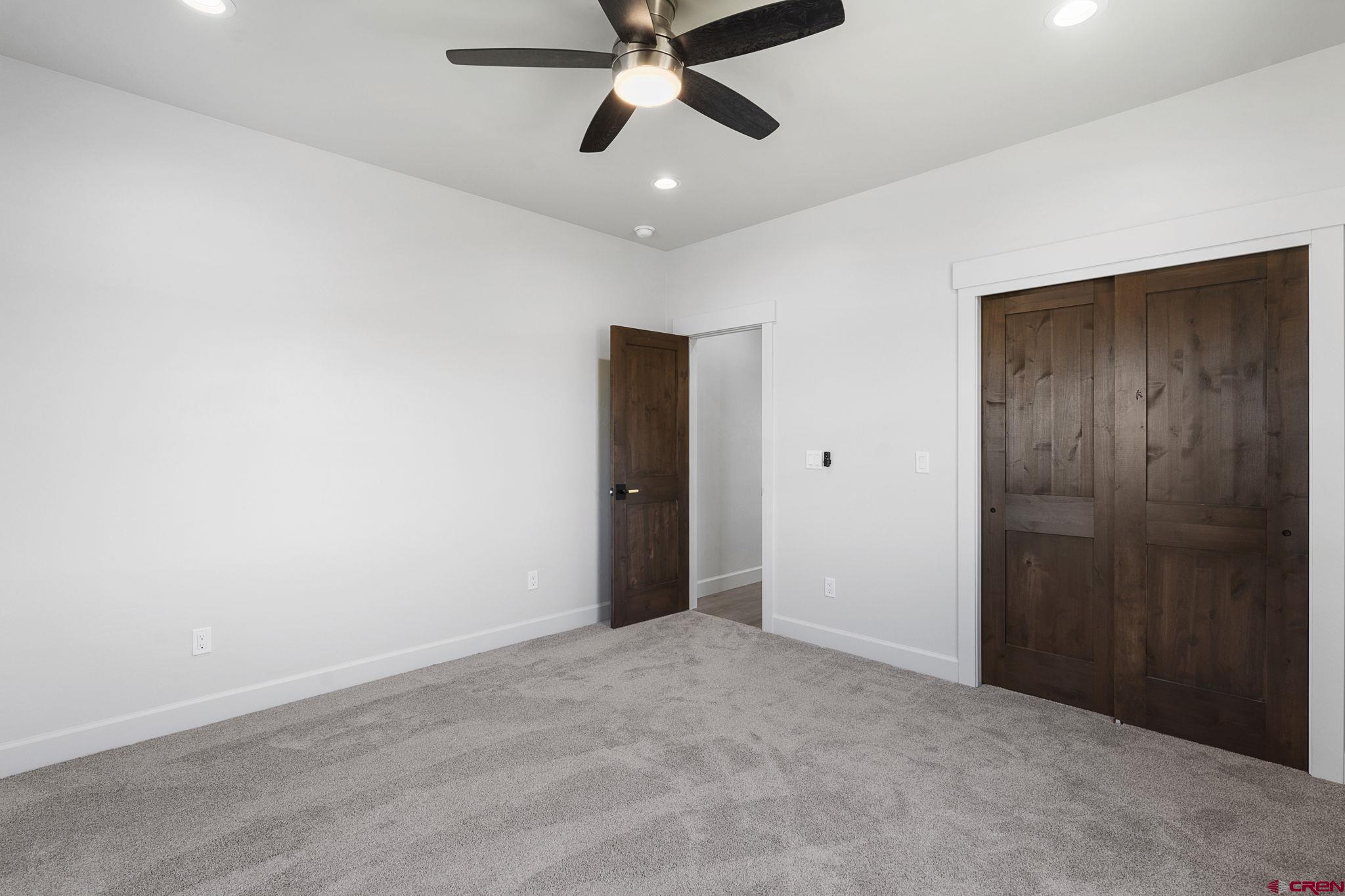 208 Petra Court Durango, CO 81303 - Photo 26 of 38 an empty room with closet and ceiling fan