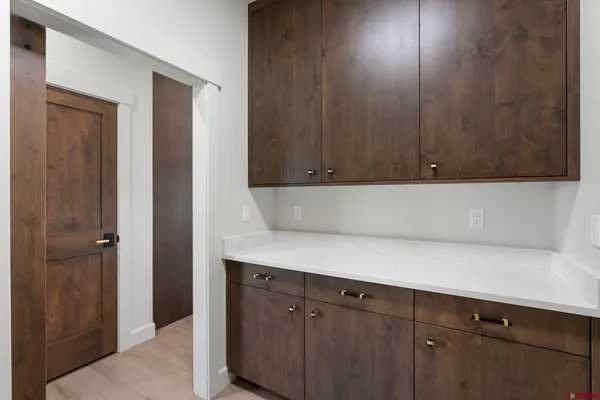 a view of cabinets with wooden floor