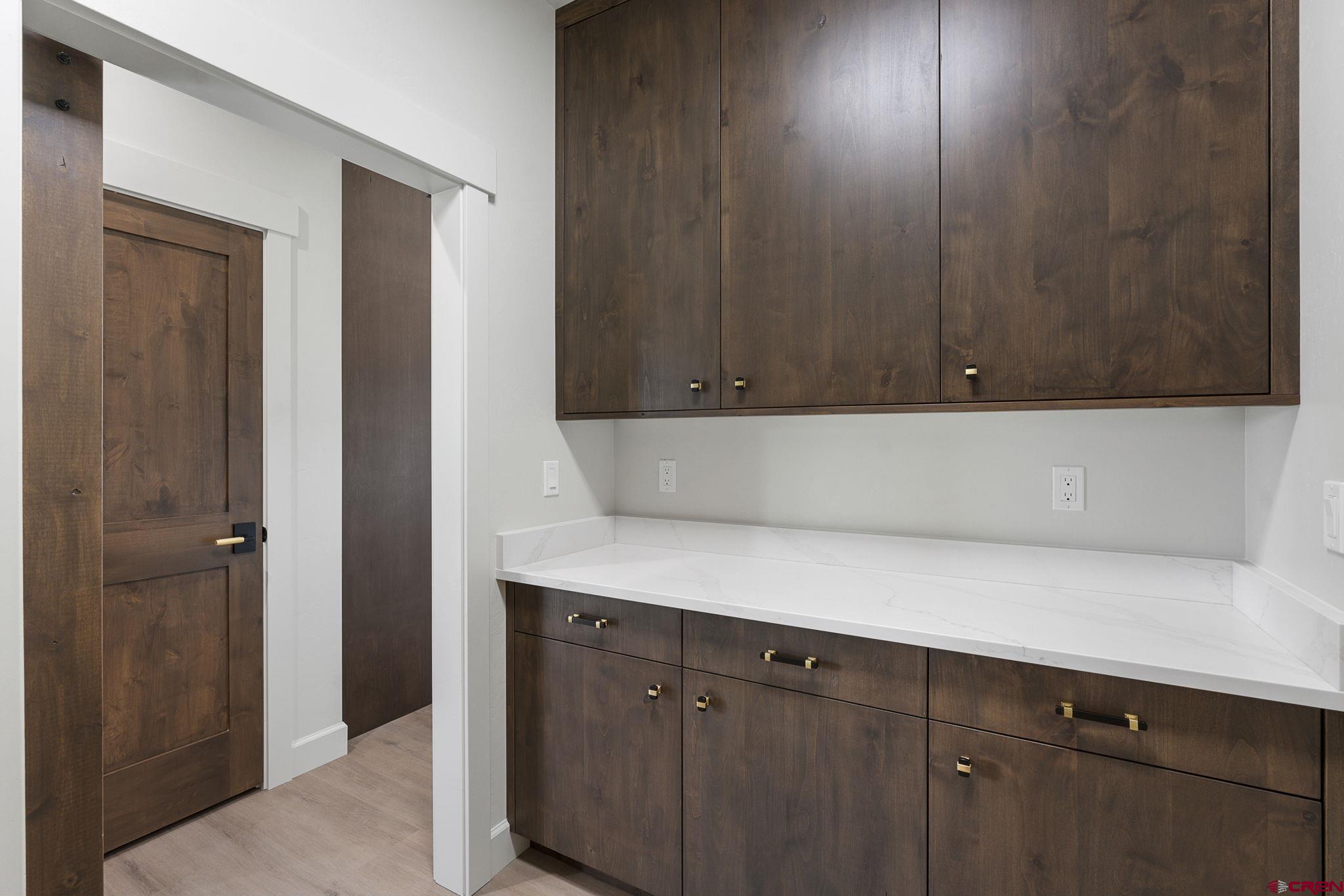 208 Petra Court Durango, CO 81303 - Photo 32 of 38 a view of cabinets with wooden floor
