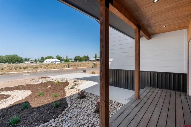 a view of balcony with wooden floor
