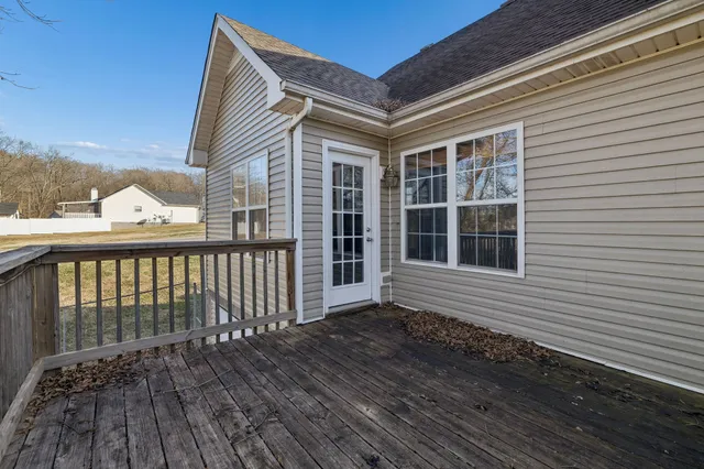 a view of a wooden balcony with wooden floor and fence