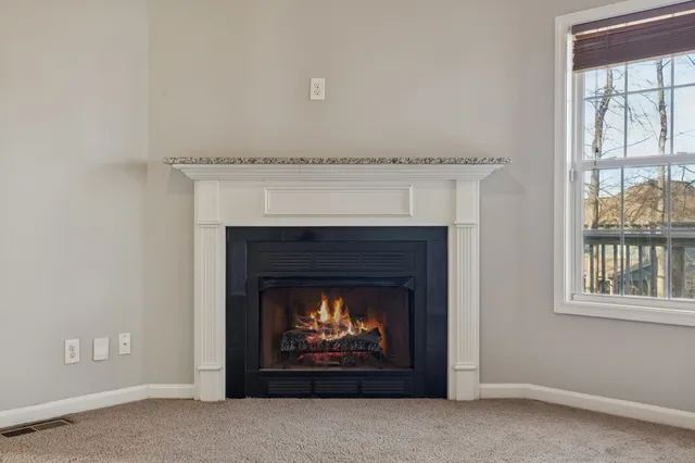 a living room with a fireplace
