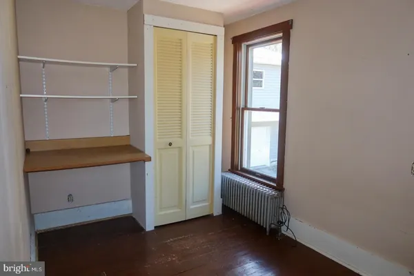 a view of hallway with walk in closet