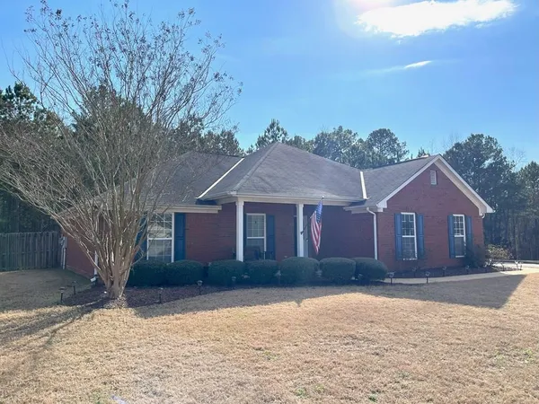 front view of a house with a yard