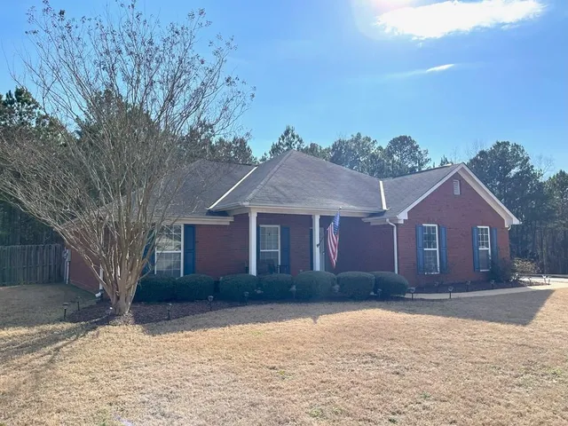 front view of a house with a yard