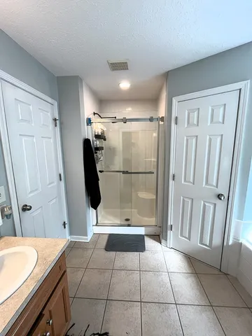 a view of a bathroom with a sink and a mirror