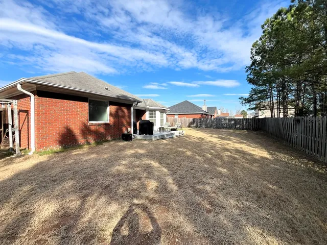 a view of outdoor space with deck and barbeque oven