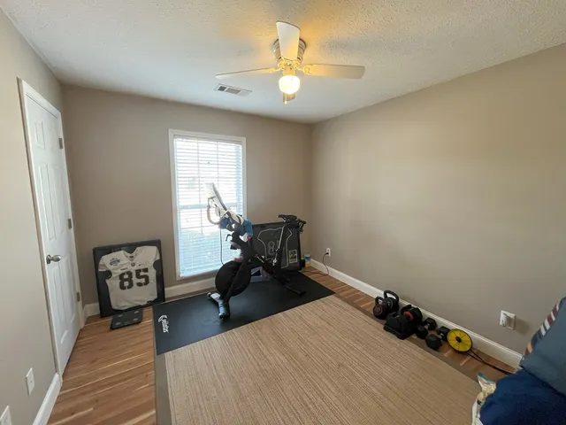 a bed room with a bed and a chandelier