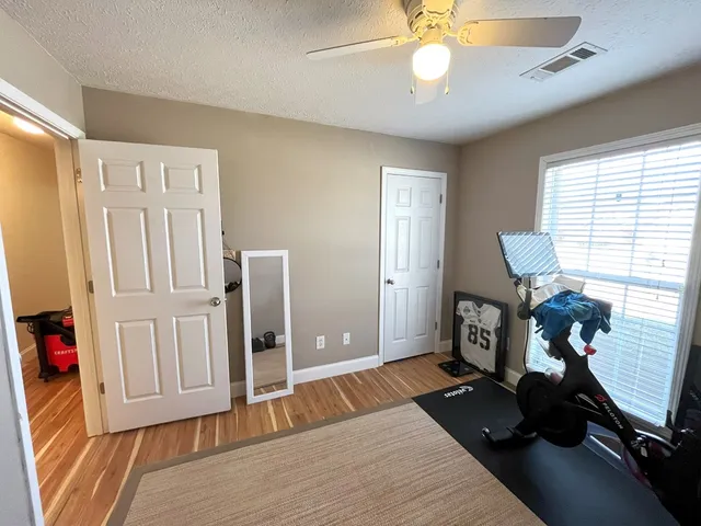 a bedroom with furniture and a window