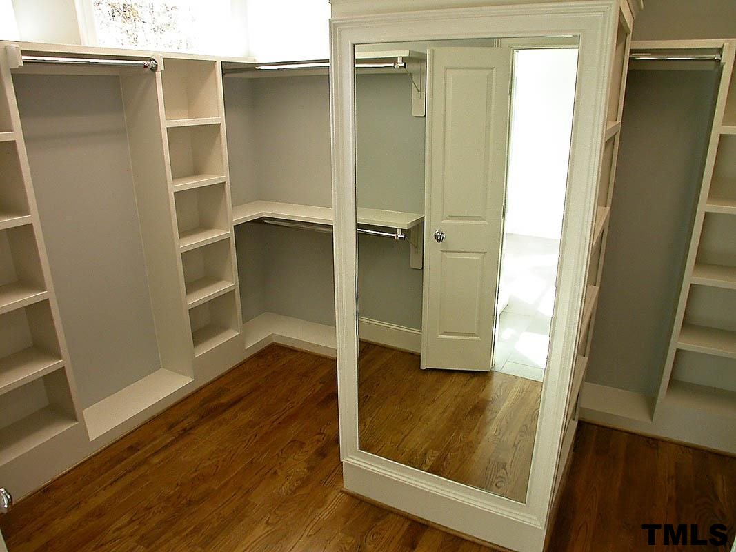 1005 Exeter Field Circle Raleigh, NC 27614 - Photo 22 of 25 a view of walk in closet with wooden floor