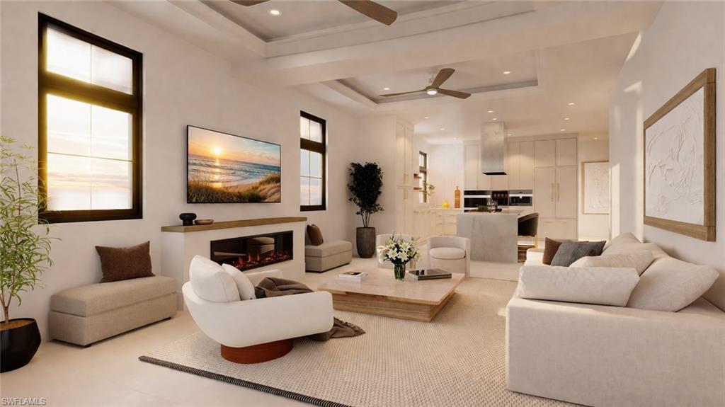 180 9th Street South, Unit 203 Naples, FL 34102 - Photo 2 of 5 a living room with furniture and a flat screen tv