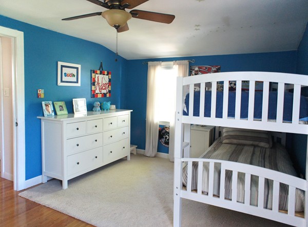 18 Vanness Road Weymouth, MA 02191 - Photo 11 of 19 a living room with furniture and a baby crib