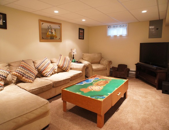 18 Vanness Road Weymouth, MA 02191 - Photo 14 of 19 a living room with furniture and a flat screen tv