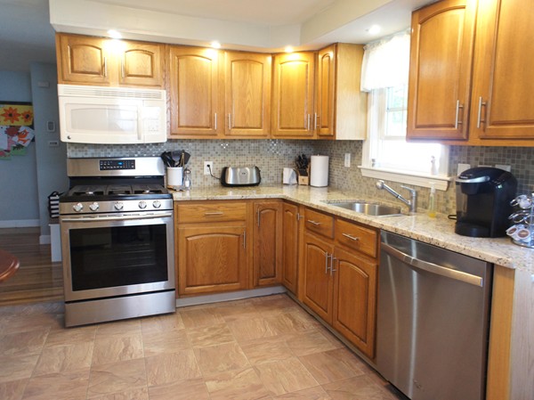 18 Vanness Road Weymouth, MA 02191 - Photo 2 of 19 a kitchen with a stove a sink and a window