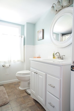 18 Vanness Road Weymouth, MA 02191 - Photo 9 of 19 a bathroom with a sink a toilet and a mirror