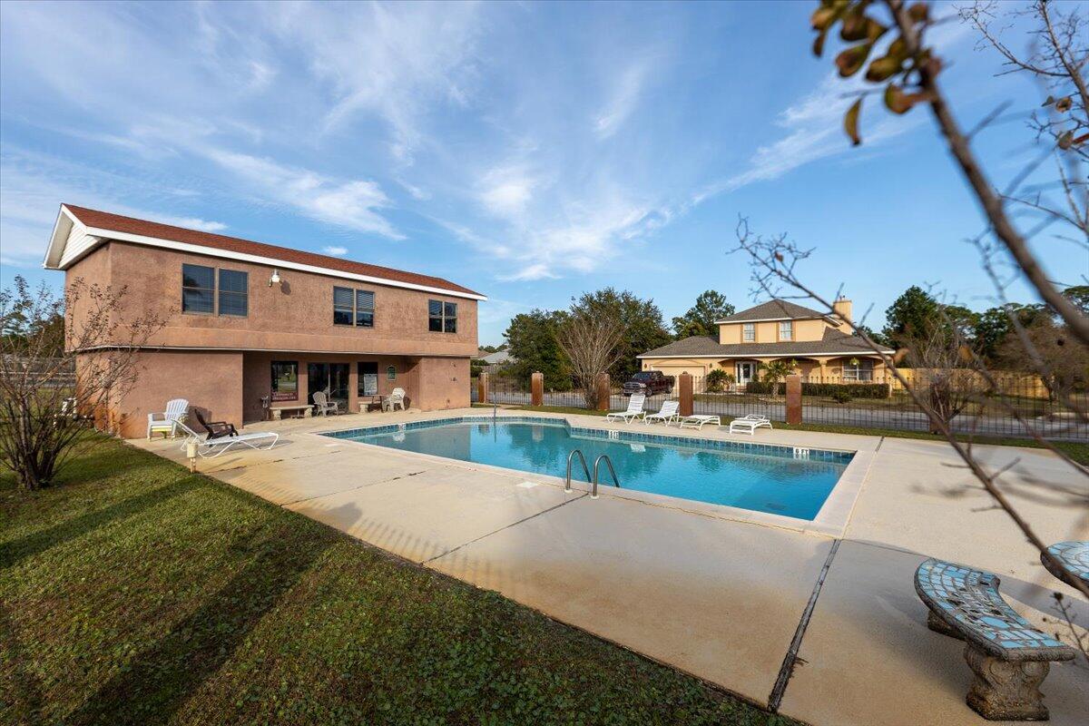 6308 Smugglers Way 2 Gulf Breeze, FL 32563 - Photo 12 of 17 a front view of a house with swimming pool