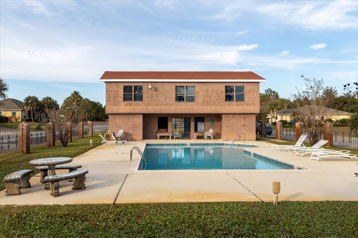 6308 Smugglers Way 2 Gulf Breeze, FL 32563 - Photo 13 of 17 a front view of a house with garden