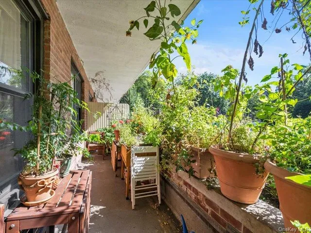 a backyard of a house with outdoor seating