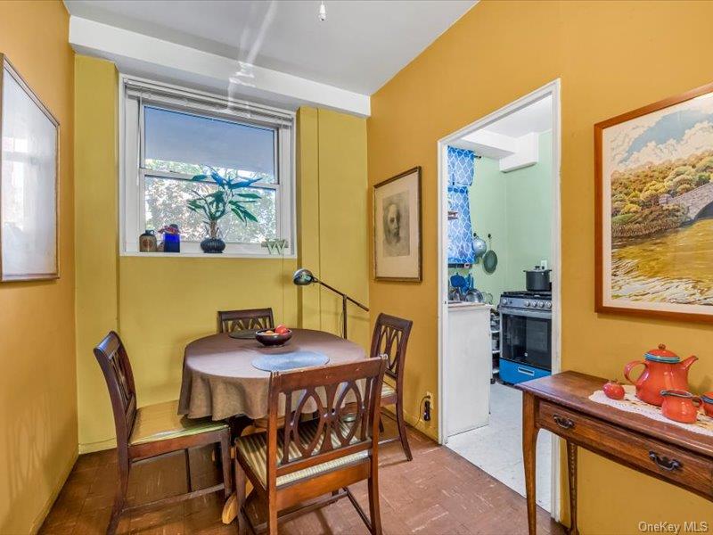 35-11 85th Street, Unit 1C Queens, NY 11372 - Photo 7 of 13 a dining room with furniture and window
