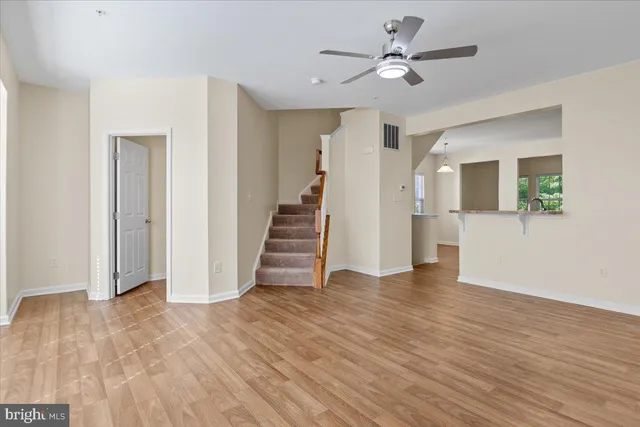 a view of an entryway with wooden floor