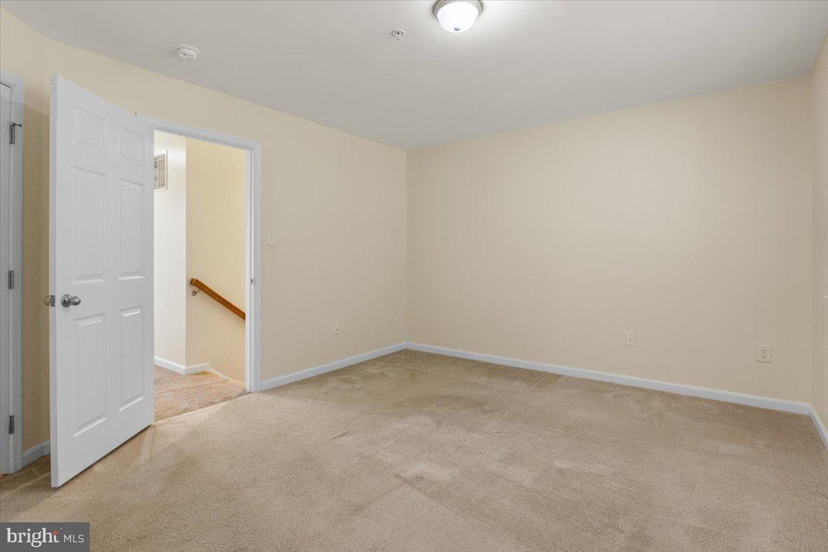 8329 Autumn Crest Lane, Unit 6 Chesapeake Beach, MD 20732 - Photo 22 of 30 an empty room with a empty space