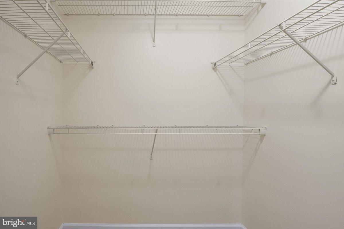 8329 Autumn Crest Lane, Unit 6 Chesapeake Beach, MD 20732 - Photo 23 of 30 a view of a room with racks on the wall