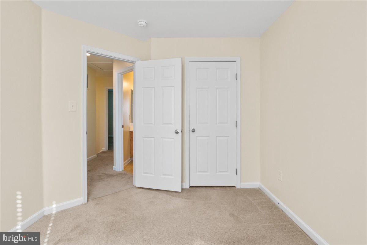 8329 Autumn Crest Lane, Unit 6 Chesapeake Beach, MD 20732 - Photo 28 of 30 an empty room with closet area
