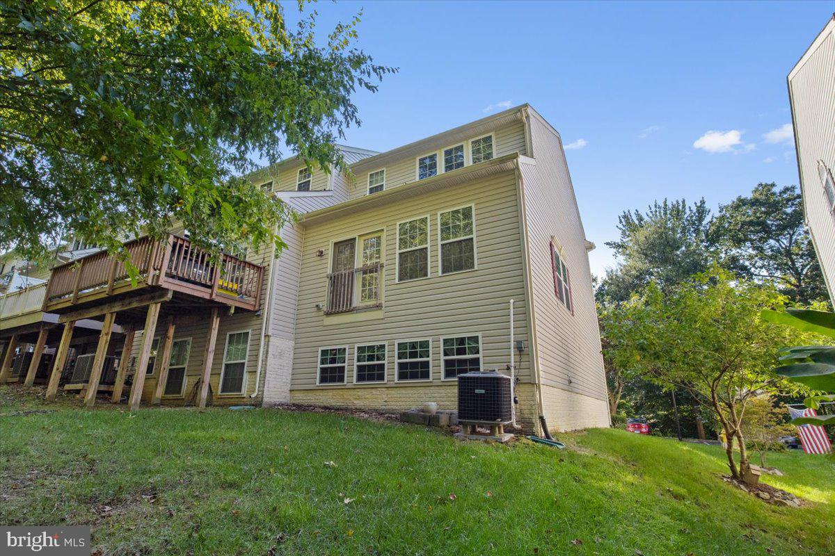 8329 Autumn Crest Lane, Unit 6 Chesapeake Beach, MD 20732 - Photo 30 of 30 a view of a house with a yard