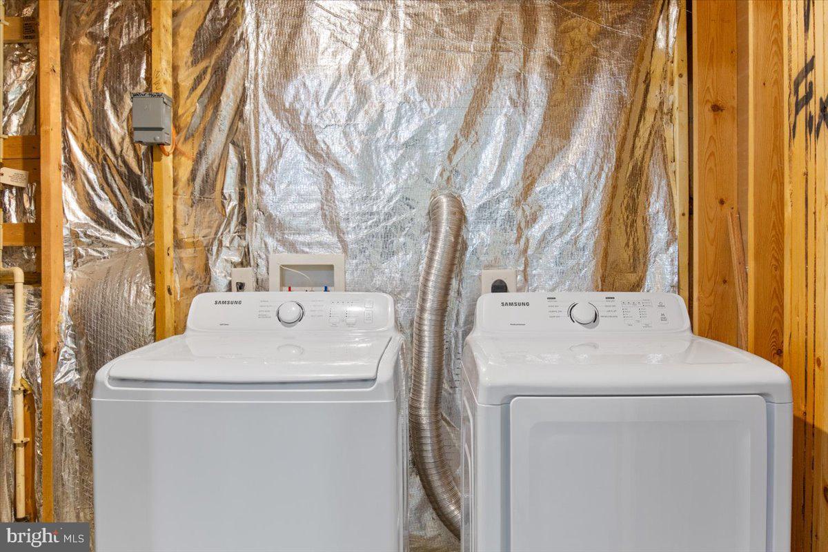 8329 Autumn Crest Lane, Unit 6 Chesapeake Beach, MD 20732 - Photo 7 of 30 a utility room with dryer and washer