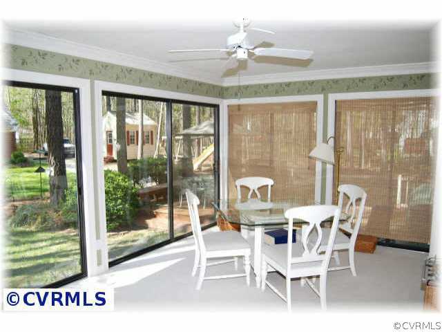 3001 East Brigstock Road Midlothian, VA 23113 - Photo 4 of 10 a dining room with furniture a chandelier and wooden floor