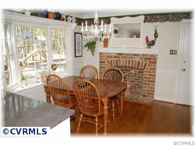 3001 East Brigstock Road Midlothian, VA 23113 - Photo 6 of 10 a view of a dining room with furniture window and outside view
