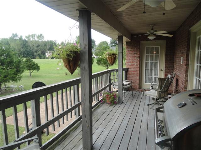 726 Vaughan Road Clarksville, TN 37043 - Photo 17 of 20 Back covered deck on main level overlooking amazing back yard. Double ceiling fans and entries from eat-in kitchen, bedroom and great room.