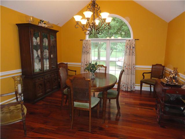 726 Vaughan Road Clarksville, TN 37043 - Photo 5 of 20 Gorgeous formal dining room with Brazilian hardwood floors extending from Great Room and hallway. Plenty of room for large table and many chairs. Picturesque window adds more drama and light to space.