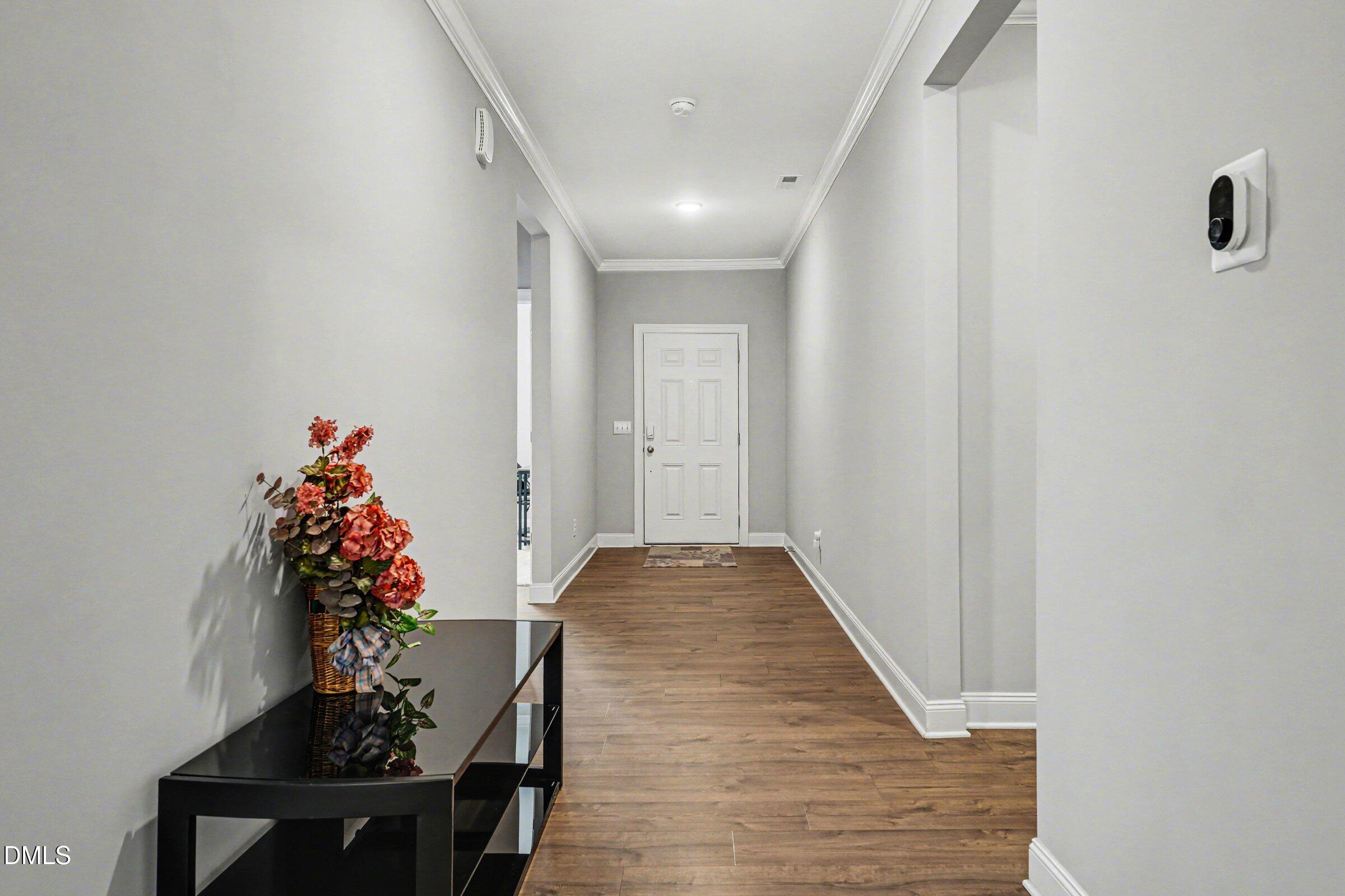130 Aylebury Ridge Zebulon, NC 27597 - Photo 5 of 41 a very nice looking hallway with a flower pot
