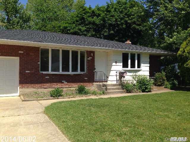9 Eva Path Commack, NY 11725 - Photo 1 of 1 a front view of a house with a yard and porch