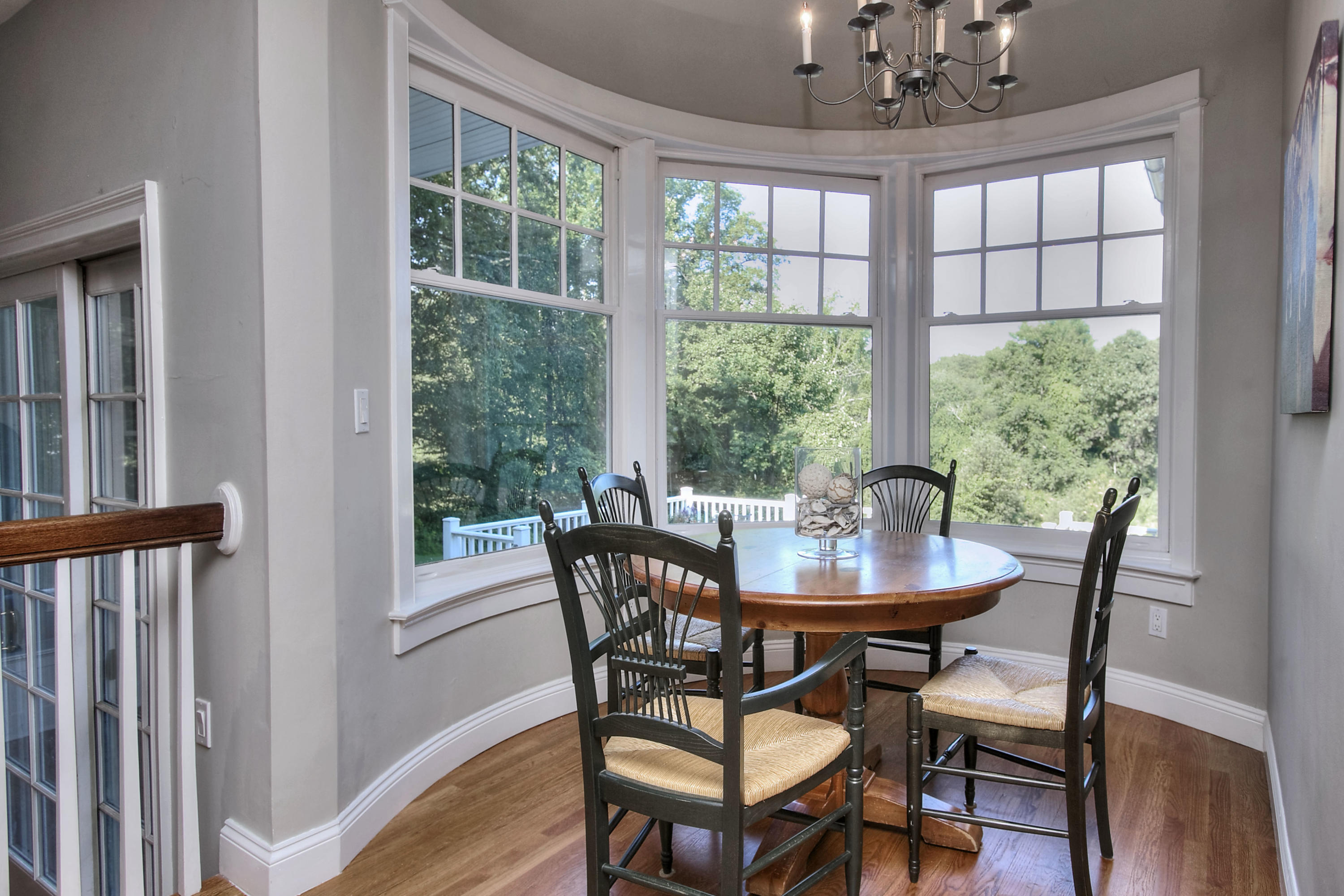 1335 Smith Ridge Road New Canaan, CT 06840 - Photo 13 of 42 a view of a dining room with furniture window and outside view
