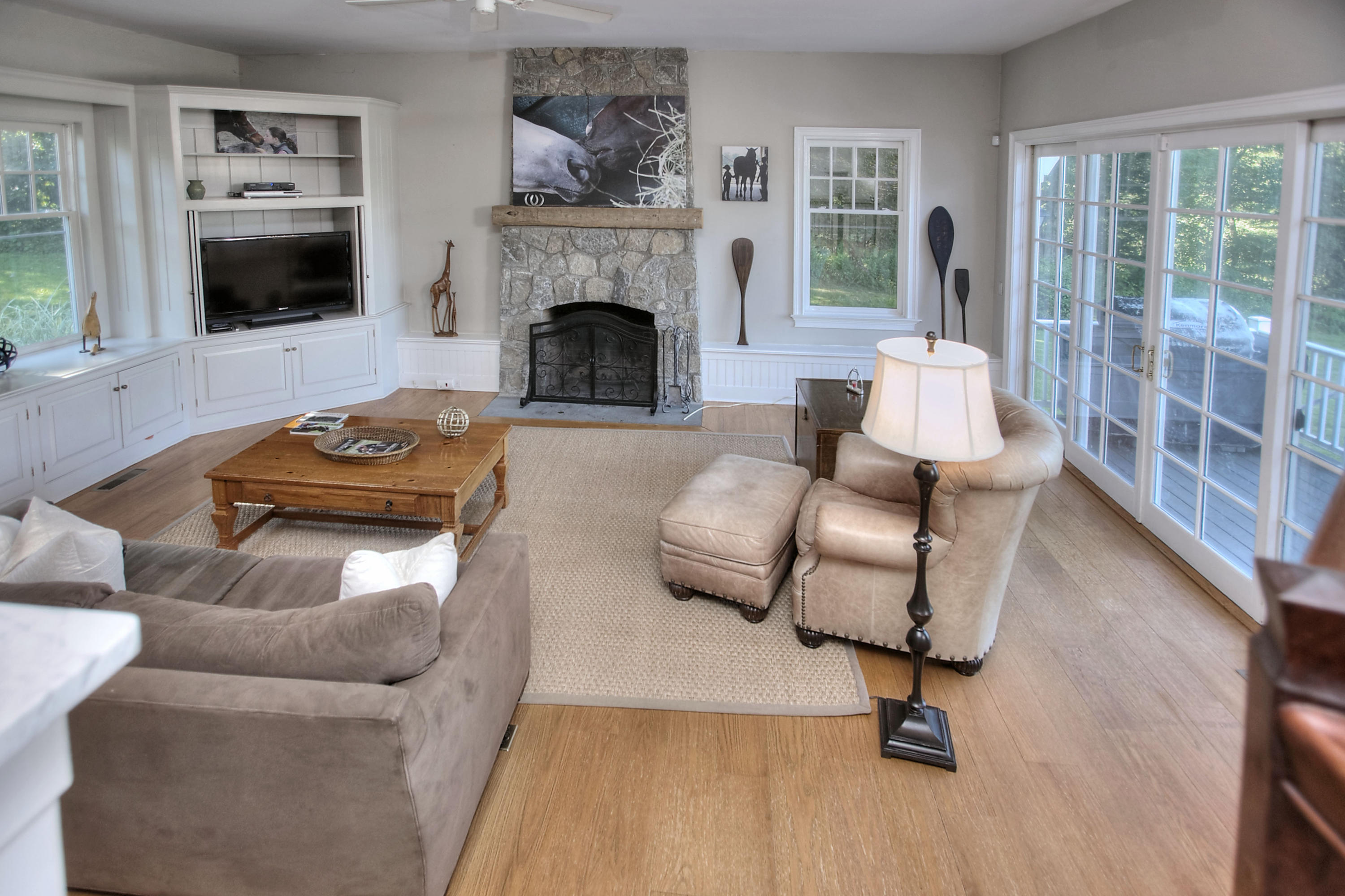 1335 Smith Ridge Road New Canaan, CT 06840 - Photo 14 of 42 a living room with furniture and a fireplace