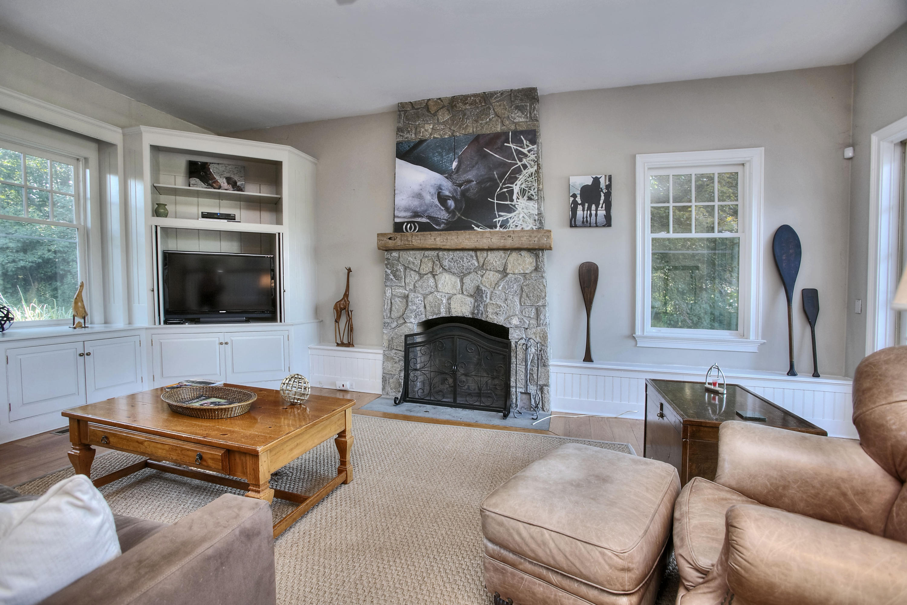 1335 Smith Ridge Road New Canaan, CT 06840 - Photo 15 of 42 a living room with furniture and a fireplace