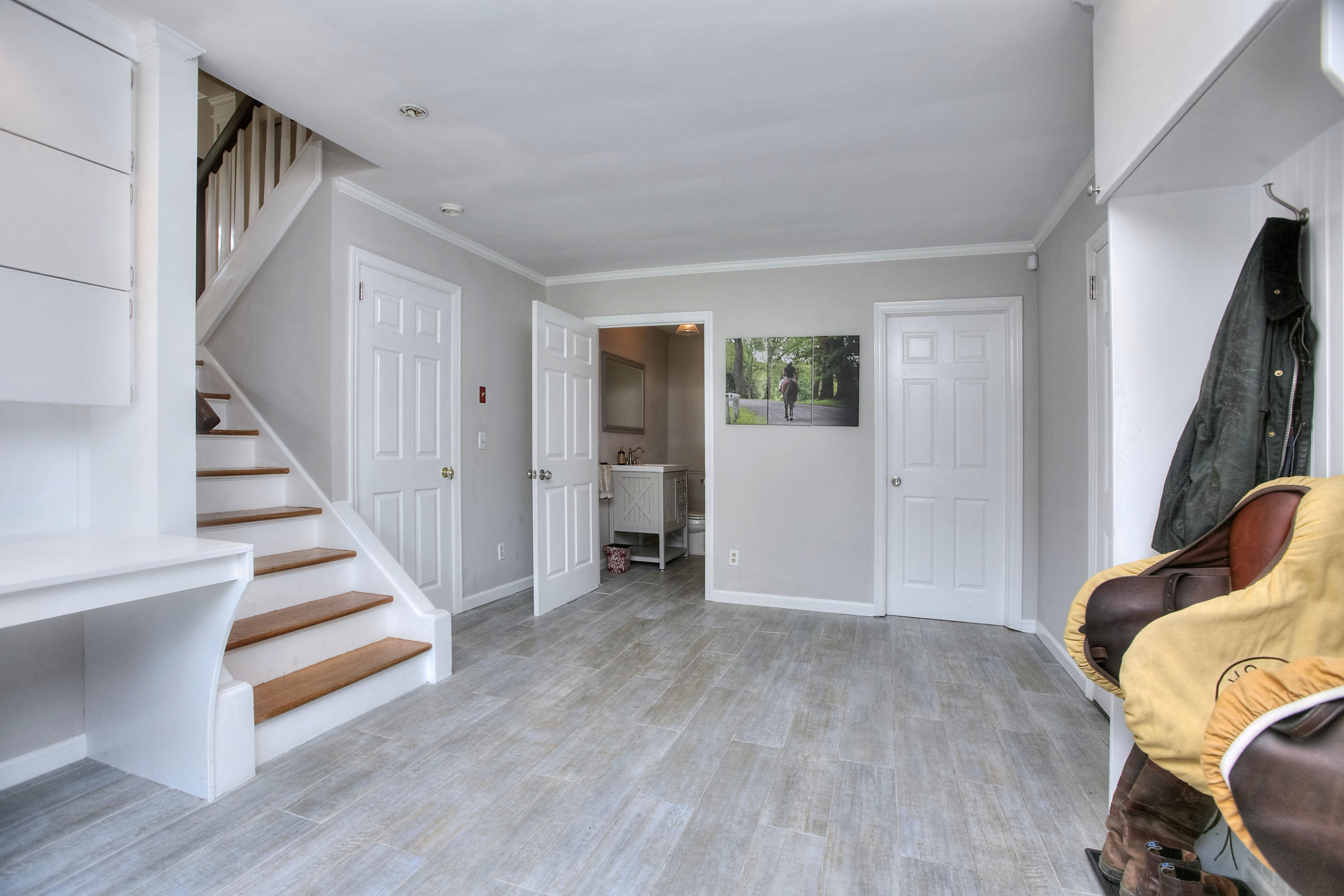 1335 Smith Ridge Road New Canaan, CT 06840 - Photo 21 of 42 a view of a hallway with wooden floor and closet