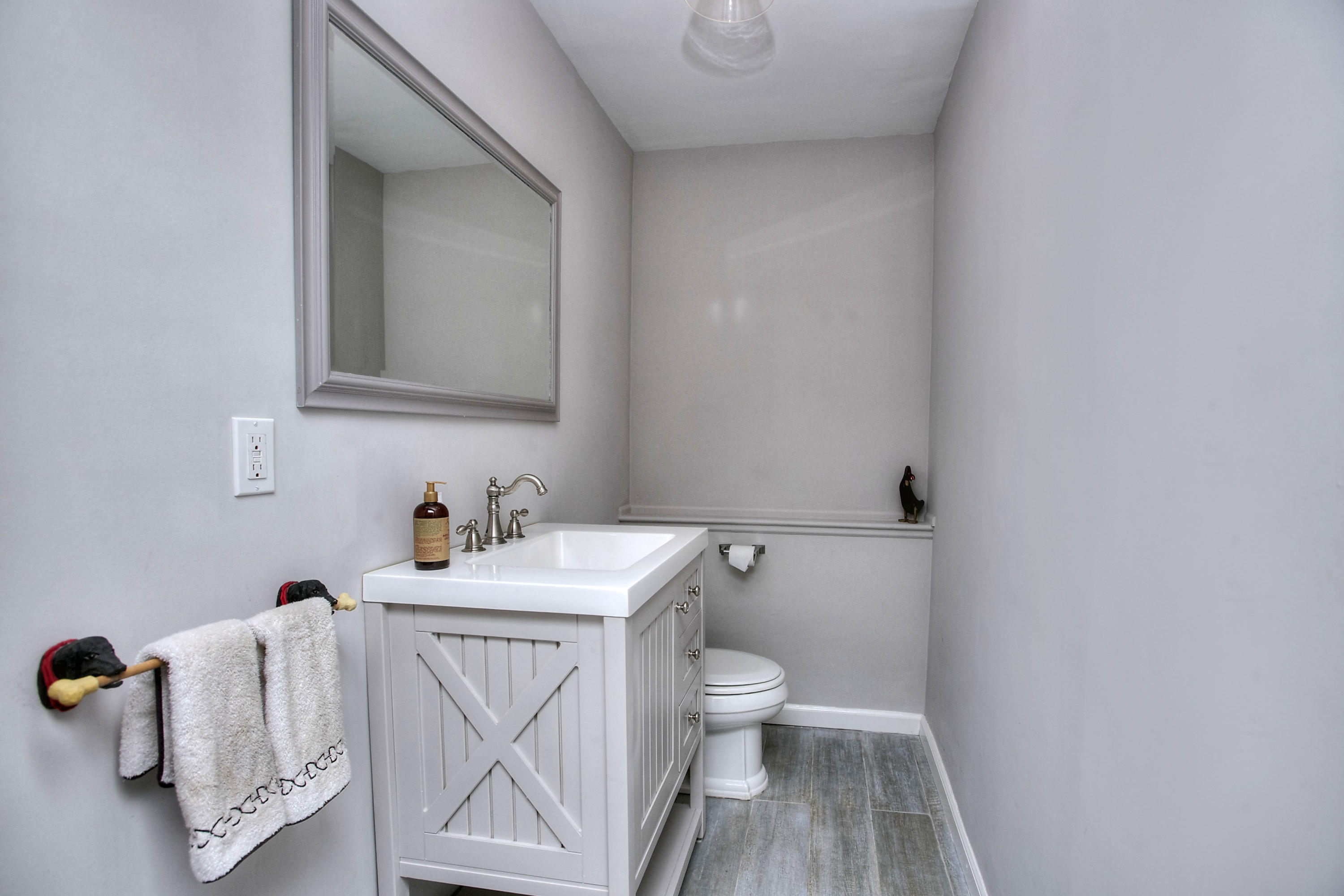 1335 Smith Ridge Road New Canaan, CT 06840 - Photo 22 of 42 a bathroom with a sink toilet and vanity