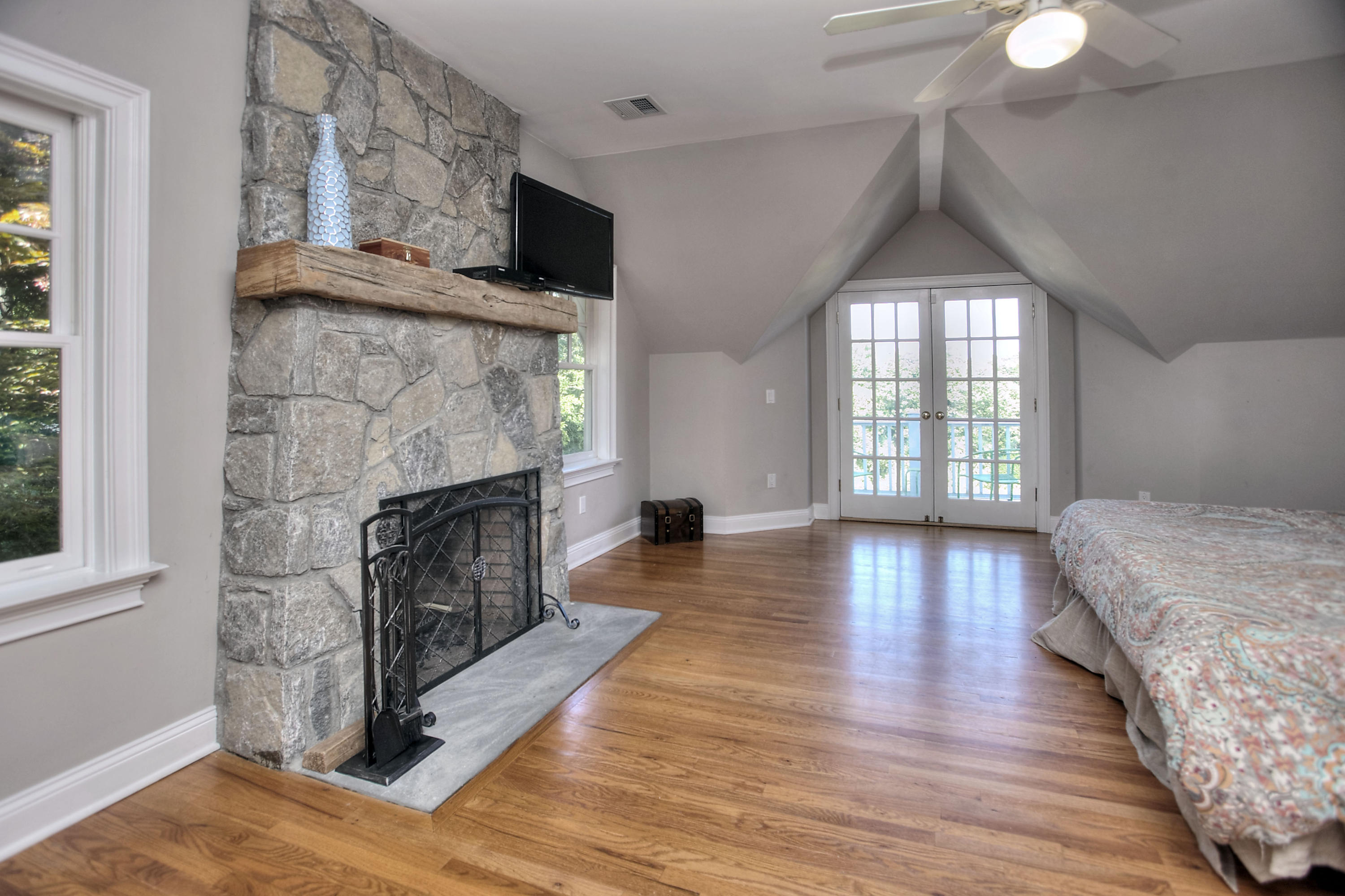 1335 Smith Ridge Road New Canaan, CT 06840 - Photo 27 of 42 a living room with furniture and a fireplace