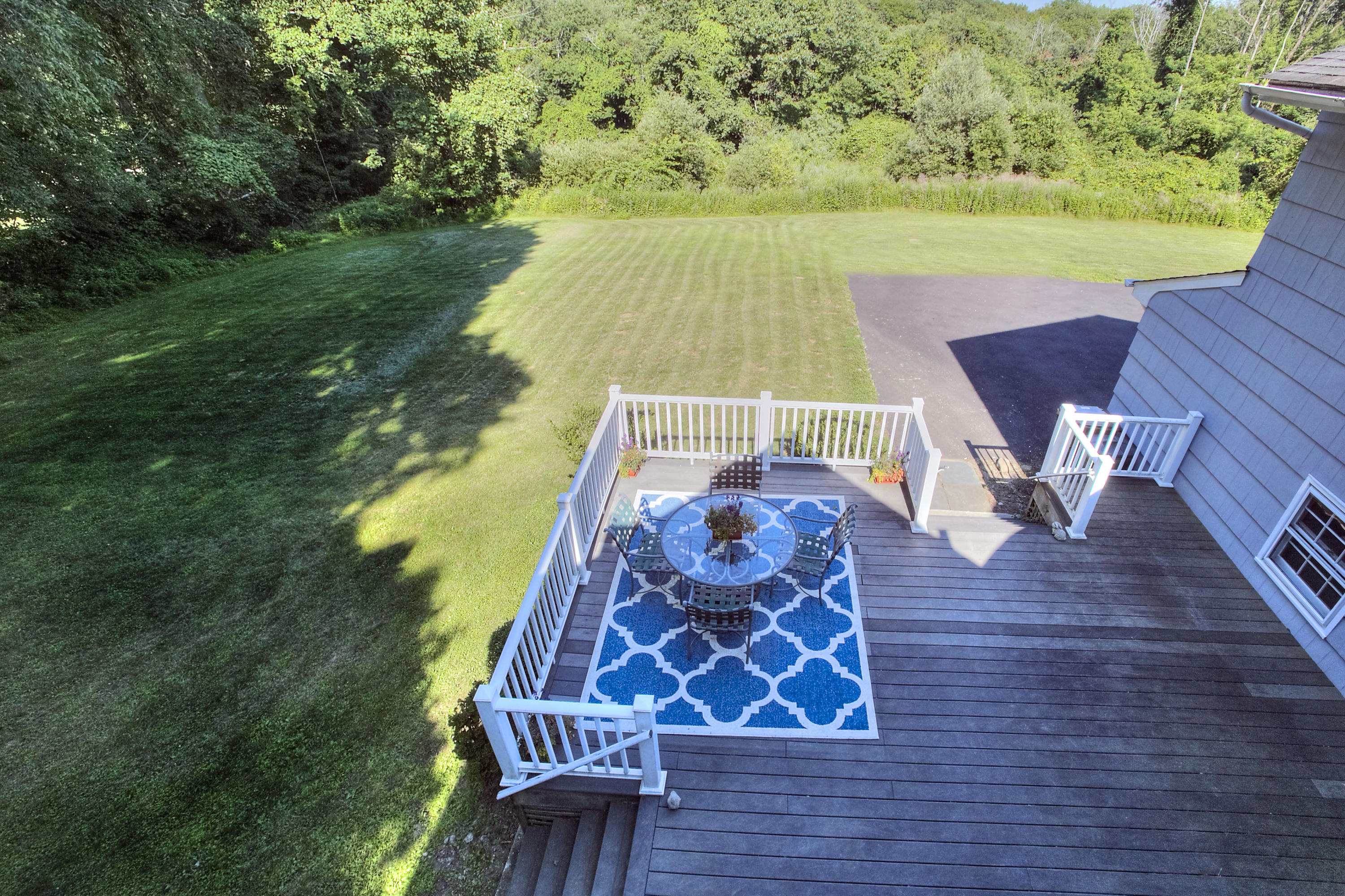 1335 Smith Ridge Road New Canaan, CT 06840 - Photo 30 of 42 a view of a chairs and table on the wooden floor